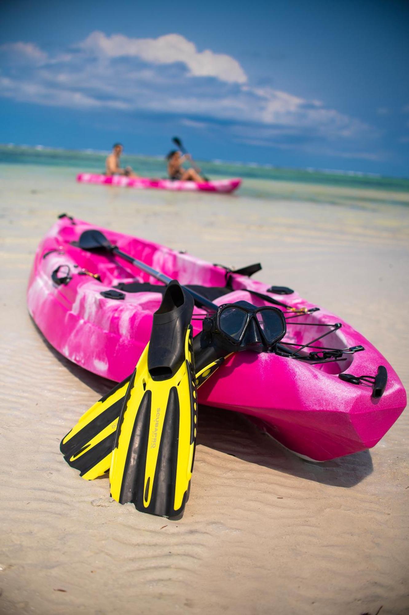 Diamonds Leisure Beach & Golf Resort Diani Beach Ngoại thất bức ảnh A sit-on-top kayak with a pair of flippers